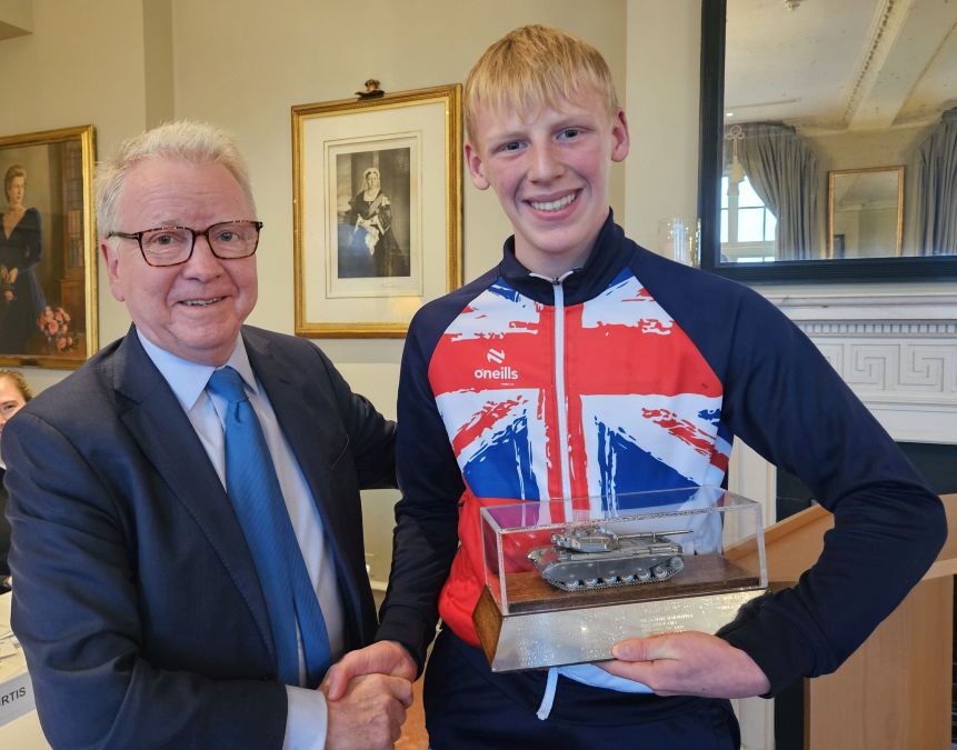 Harley Coster receives the Lascelles Junior Trophy from Lord Moynihan at the 2025 BWSW AGM